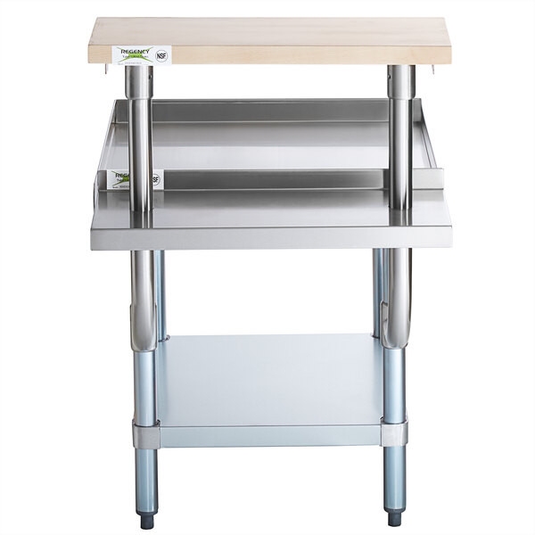 A Regency stainless steel equipment stand with a galvanized undershelf and wooden cutting board on a shelf.