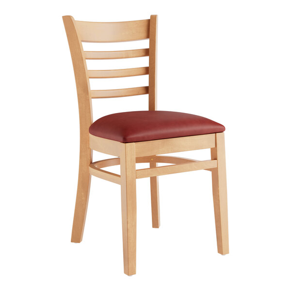 A Lancaster Table & Seating wooden restaurant chair with a burgundy vinyl seat