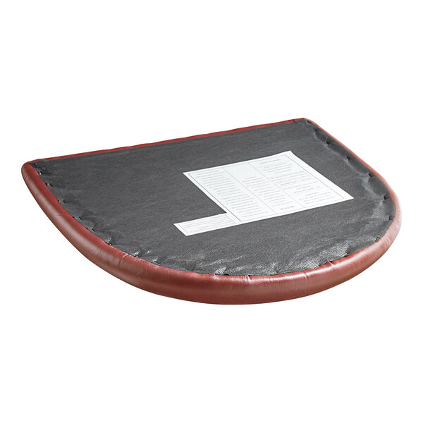 A Lancaster Table & Seating wood restaurant chair with a burgundy detached seat on a table with a black and red mat and a white paper on it.