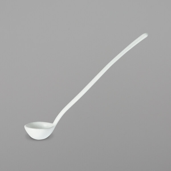 A white ladle with long handle.