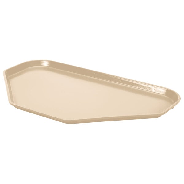 A beige trapezoid-shaped MFG fiberglass cafeteria tray.