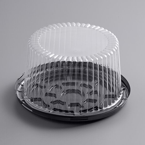 A Choice plastic cake container with a clear dome lid.