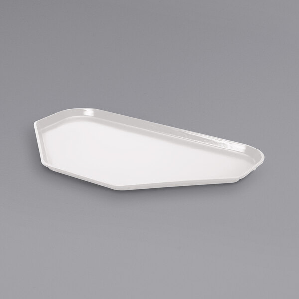 A white fiberglass trapezoid cafeteria tray.