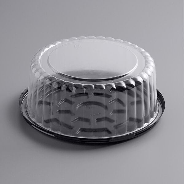 A clear plastic Choice cake container with a clear lid.