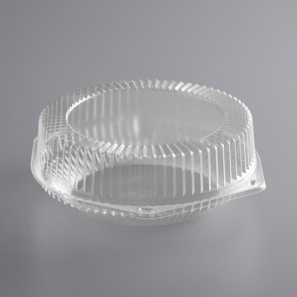 A clear plastic Choice pie container with a wavy edge and a lid.