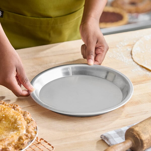 A round, shallow 9-inch aluminum pie pan.