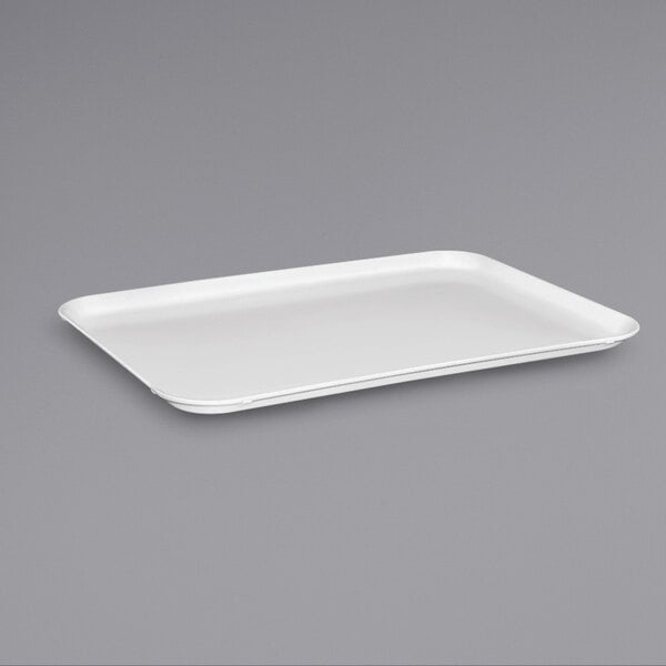 A white rectangular MFG Tray on a gray background.