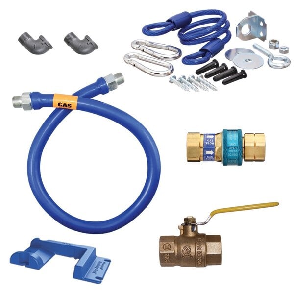 A blue Dormont gas connector kit with various tools and a yellow label.