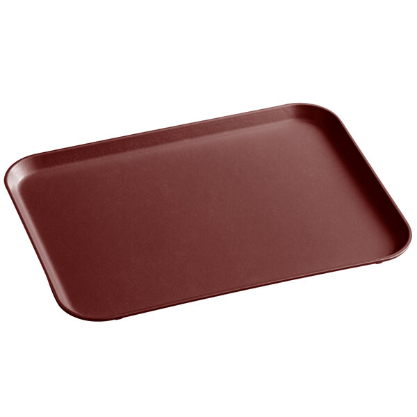 A rectangular burgundy MFG Tray on a counter.