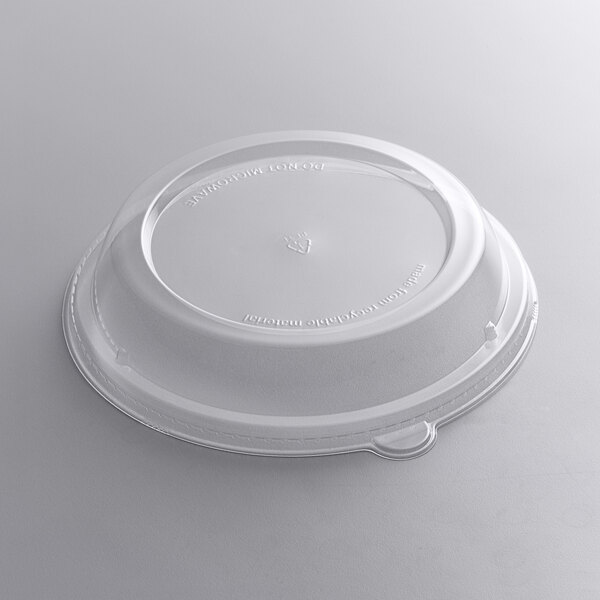 A clear plastic round dome lid on a white background.