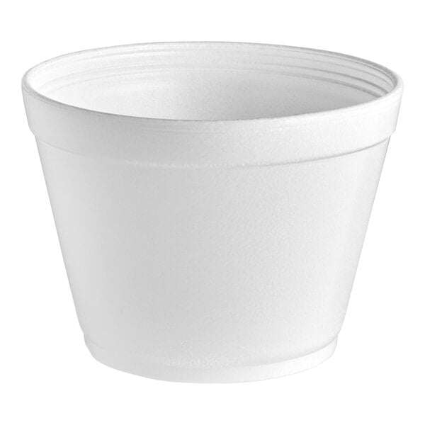 A close-up of a Dart white foam container.
