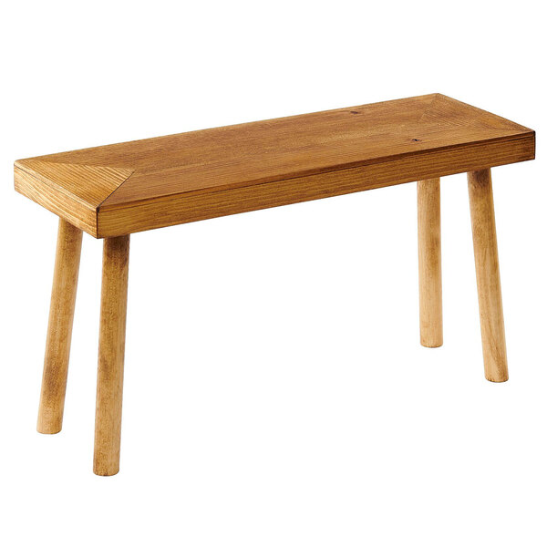 A wooden bench with a triangular top.