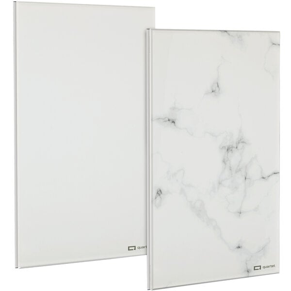 Two white rectangular frameless glass dry erase boards with a white marble pattern.