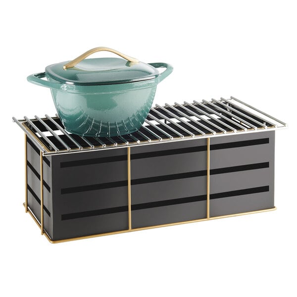 A green pot sits on a Cal-Mil Empire Chafer Alternative.