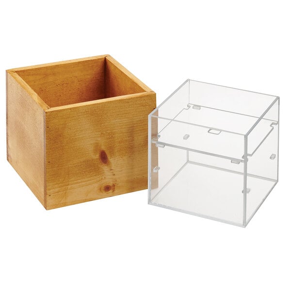 A wooden box with a clear plastic container inside.