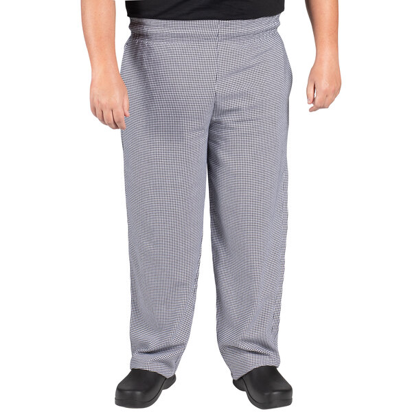 A person wearing Uncommon Chef houndstooth chef pants.