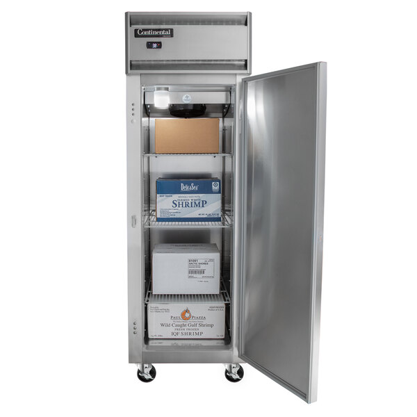 A Continental Refrigerator reach-in freezer with a silver door open and a box on top.