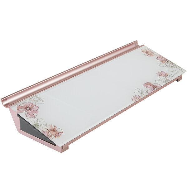 A white rectangular Quartet glass desktop pad with pink floral designs.