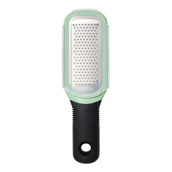 An OXO stainless steel grater with a non-slip handle.