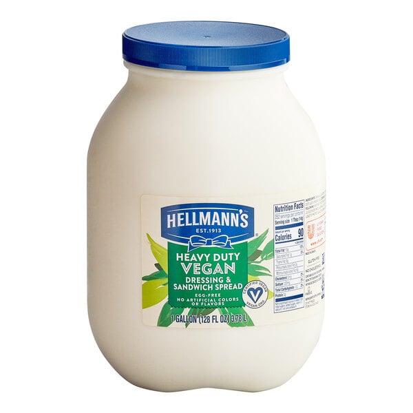 A 1-gallon container of Hellmann's heavy duty vegan mayonnaise spread with a blue lid.