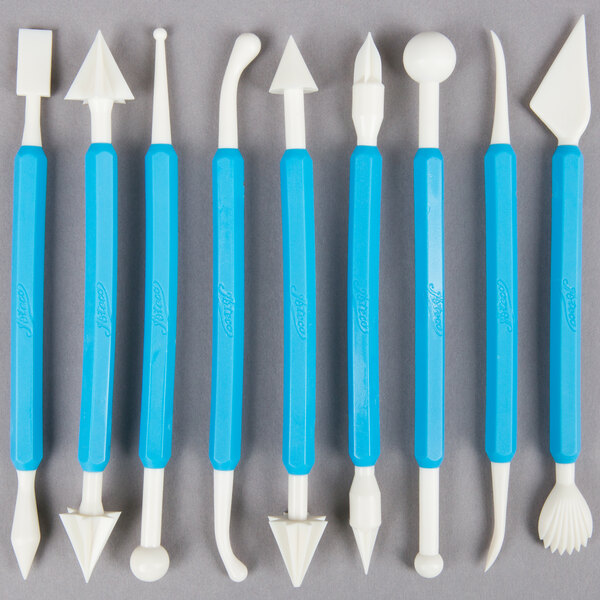 A blue rectangular Ateco sculpting set box with white writing on it.