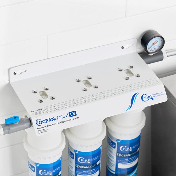 A triple water filtration system with three filter cartridges, a pressure gauge, and labeled as the C Pure Oceanloch+ L3 model.