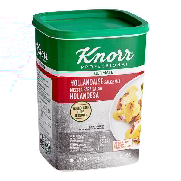 A green and white Knorr Ultimate Hollandaise Sauce container on a table.