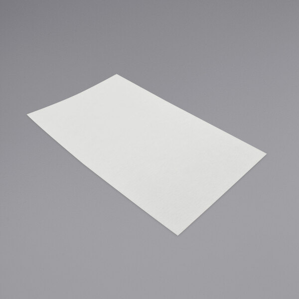 A white rectangular piece of FMP filter paper.