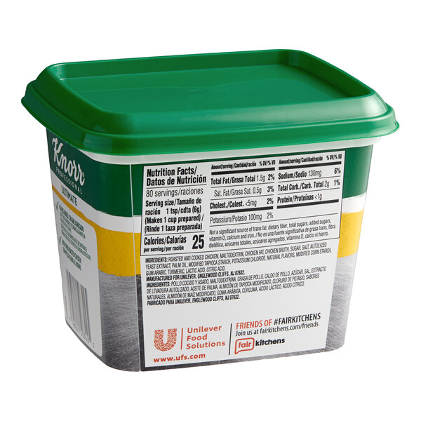A plastic container of Knorr Ultimate Low Sodium Chicken Bouillon Base with a green lid.