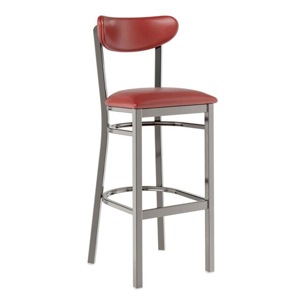 A Lancaster Table & Seating bar stool with a burgundy vinyl seat and back and metal legs.