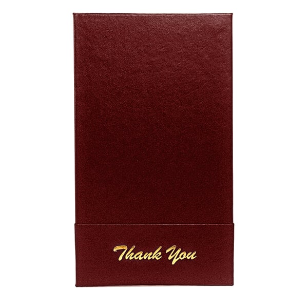 A white rectangular check presenter with gold text on the front.