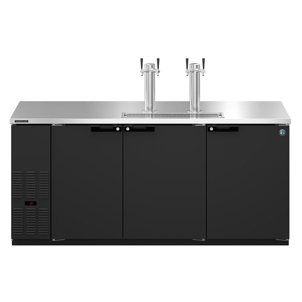 a group of silver beer taps