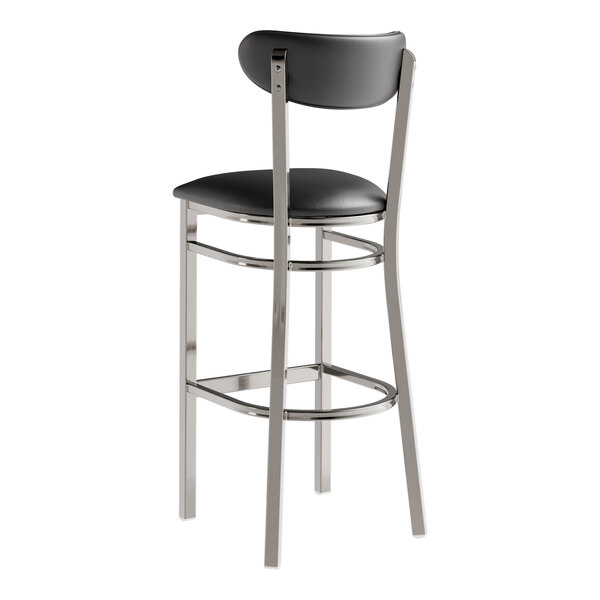 A Lancaster Table & Seating black bar stool with chrome legs.