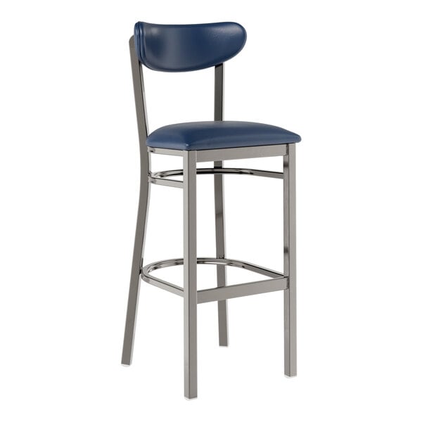 A Lancaster Table & Seating bar stool with a navy cushion and metal frame.