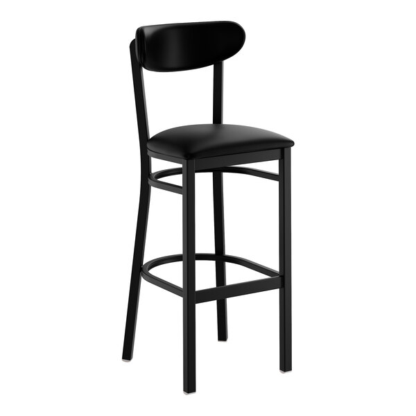 A black bar stool with a black vinyl seat and backrest, featuring a metal frame and footrest.