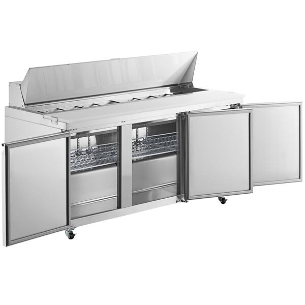 An Avantco stainless steel refrigerator with two open doors.