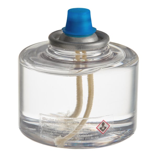 A clear liquid candle fuel cartridge with a blue cap and visible wick, designed for commercial use.