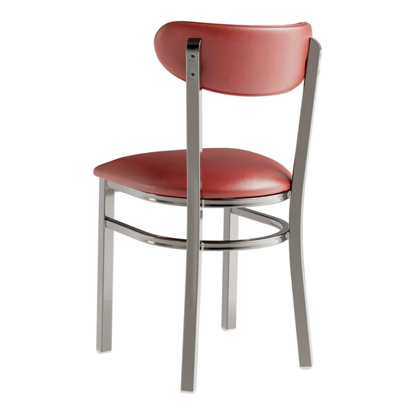 A Lancaster Table & Seating clear coat chair with burgundy vinyl seat and back and metal legs.