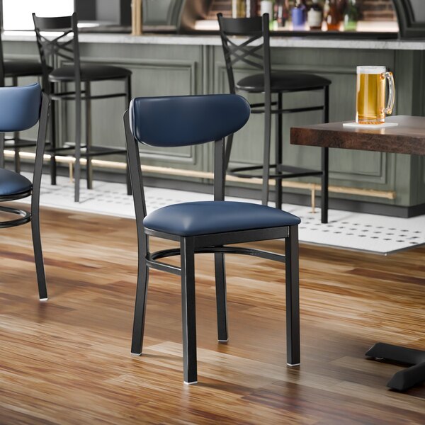 A black metal chair with a navy vinyl seat and backrest.