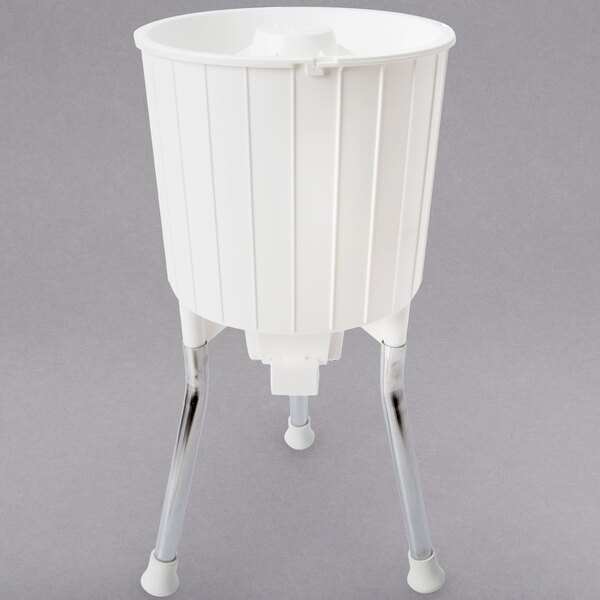 A white plastic container with metal legs.