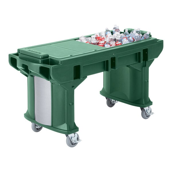 A green Cambro Versa work table with heavy duty casters holding a green plastic bin with bottles in it.