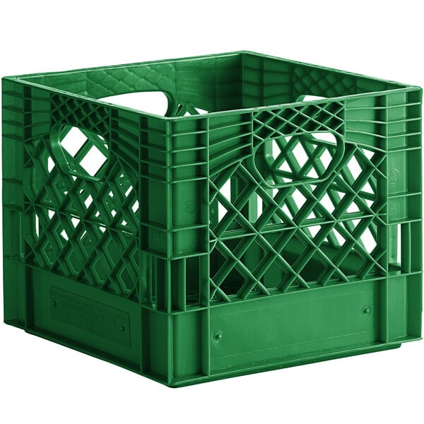 A green plastic milk crate with holes and handles.