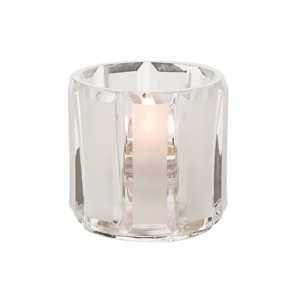 a candle holder with a lit candle