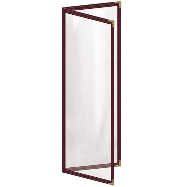 A glass door with gold corners displaying a maroon menu with gold decorative corners.