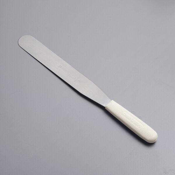 A Dexter-Russell metal baking / icing spatula with a white handle.