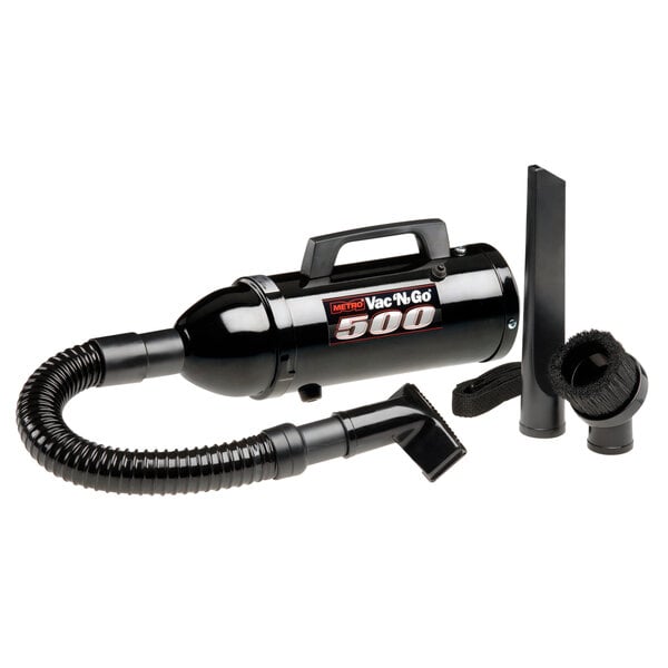 A black MetroVac handheld canister vacuum with a hose.