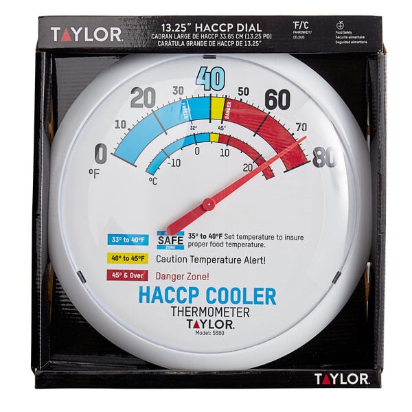 A Taylor white round cooler / freezer thermometer with red and blue text.