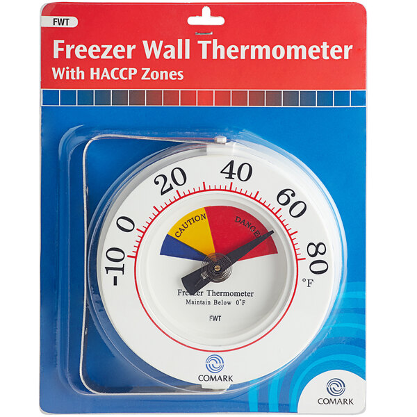 A white Comark HACCP freezer thermometer in a package with red, yellow, and blue text.