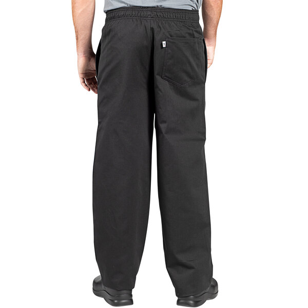 A man wearing Uncommon Chef black chef pants.