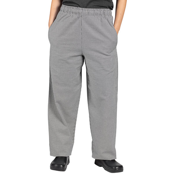 A pair of Uncommon Chef houndstooth chef pants in black and white.